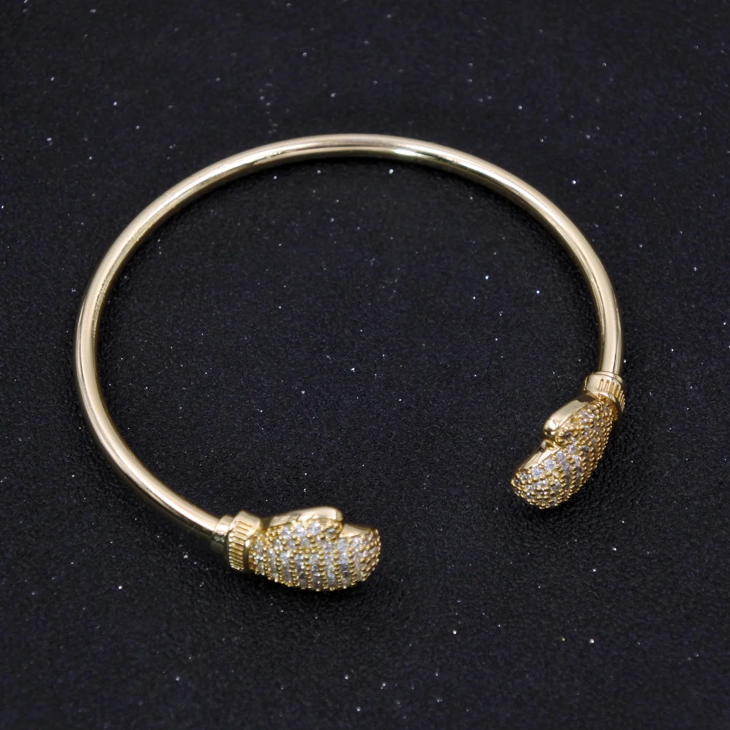 GOLD BOXING GLOVE TORQUE BANGLE WITH STONES